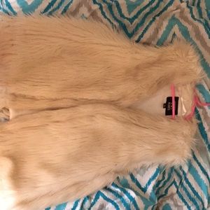 For $5 you can get this furry vest size s
